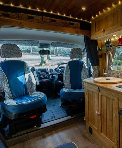 Family enjoying caravan at sunset